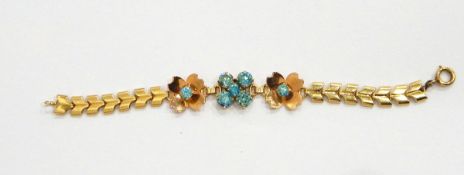 A gold-coloured bracelet,