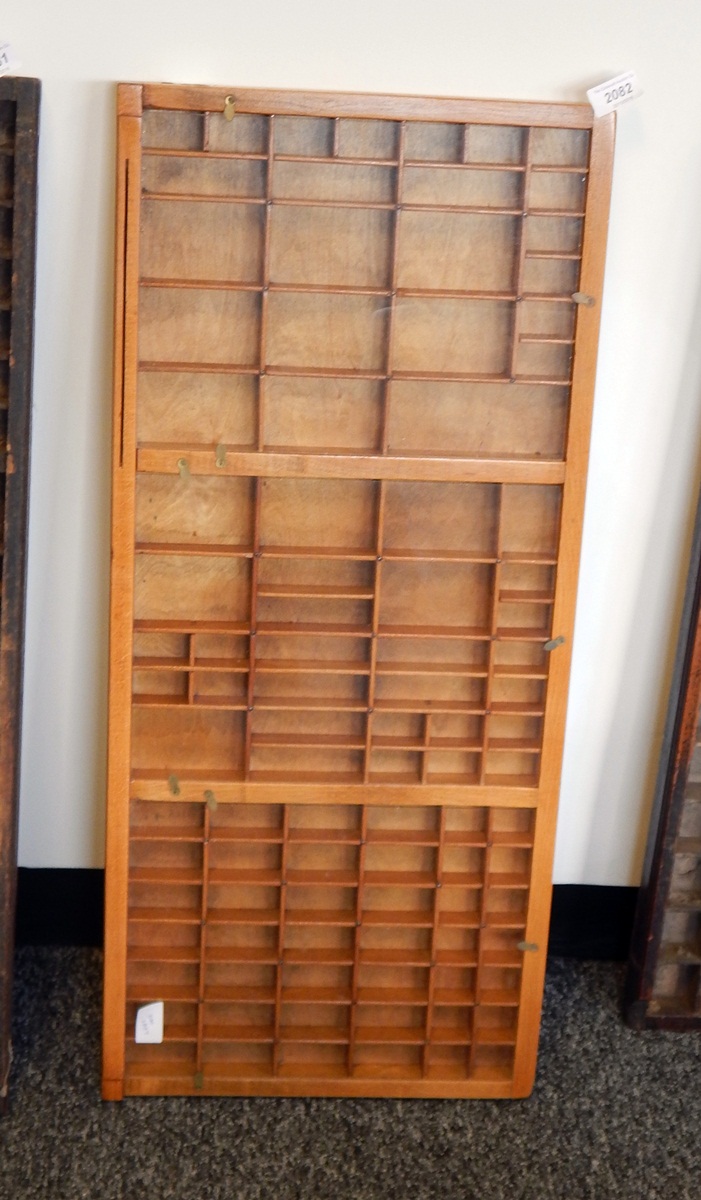 A set of wooden specimen shelves with glazed panels
