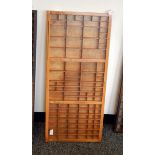 A set of wooden specimen shelves with glazed panels