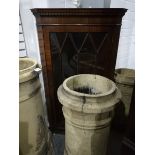 A mahogany hanging corner cupboard having dentil cornice over a astragal bi-glazed door,