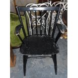 Three ebonised stickback open armchairs