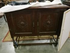 A mahogany sideboard with pair carved cupboard doors,