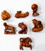 Seven carved wooden netsukes, mouse with corn,