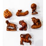 Seven carved wooden netsukes, mouse with corn,