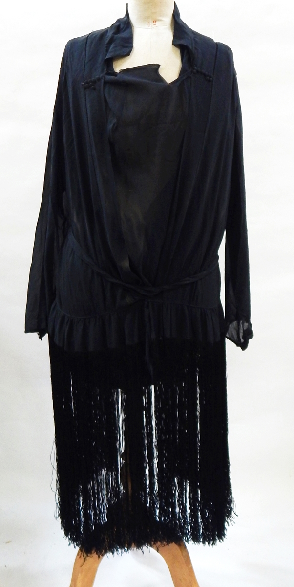 A black chiffon 1920's flapper style dress, the skirt with full fringing, inset bodice,