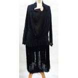 A black chiffon 1920's flapper style dress, the skirt with full fringing, inset bodice,