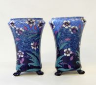 Pair of Mailing footed vases, with floral decoration in blues and purples,