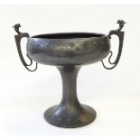 An Art Nouveau two-handled pewter cup, 23cm high approx.