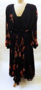 A black chiffon maxi dress by Wayne Clark Studio, printed with Chinese style goldfish,