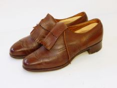 A pair of brown leather gentleman's shoes marked on inner leather sole "Bootmakers Peal & Co Ltd,