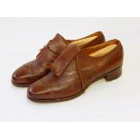 A pair of brown leather gentleman's shoes marked on inner leather sole "Bootmakers Peal & Co Ltd,