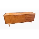 A Fyne Ladye Richard Hornby afrormosia sideboard with four short drawers and cupboard to reveal