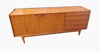 A Fyne Ladye Richard Hornby afrormosia sideboard with four short drawers and cupboard to reveal