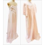 A pink cotton negligee set trimmed with lace and pink ribbon and pique flowers,