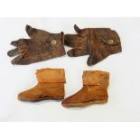 A pair of leather baby shoes possibly circa 1850 and a pair of child's leather gloves with a stud