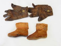 A pair of leather baby shoes possibly circa 1850 and a pair of child's leather gloves with a stud