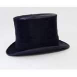A black top hat named "Lincoln Bennett & Co, Sackville Street, Picadilly, London",