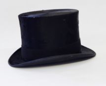 A black top hat named "Lincoln Bennett & Co, Sackville Street, Picadilly, London",