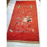 A late 19th century Chinese embroidered silk temple hanging, red ground with figures,