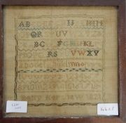 A late 18th/early 19th century sampler with the alphabet and with embroidered depictions of crowns