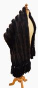 A black astrakhan coat with dark mink collar, Marshall & Snelgrove,