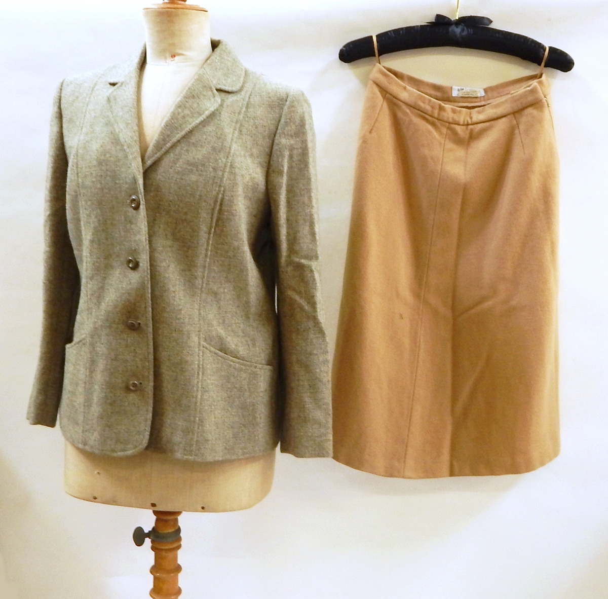 A large quantity of vintage tweed skirts, including Jaeger, etc.