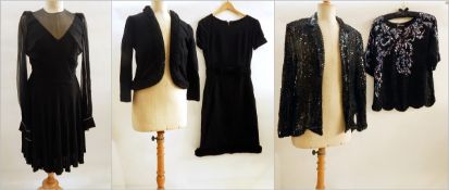 A black wool 1950's dress with matching jacket with tight frill trim to neckline and hem to jacket,
