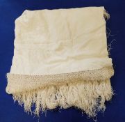 A cream silk embroidered early 20th century shawl