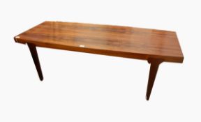 A 20th century rosewood Danish coffee table on square tapering legs,