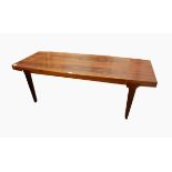 A 20th century rosewood Danish coffee table on square tapering legs,