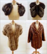 Two fox fur capes,