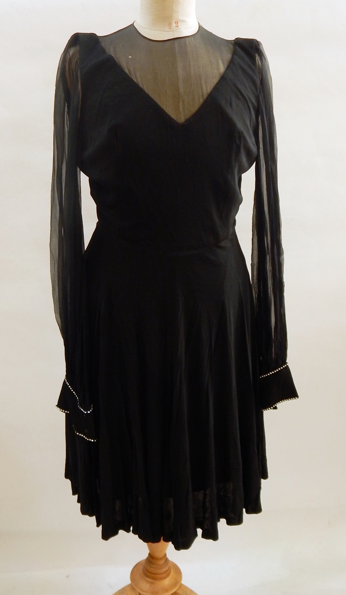 A black wool 1950's dress with matching jacket with tight frill trim to neckline and hem to jacket, - Image 2 of 4