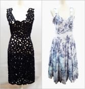 A black laser cut cocktail dress with a 1950's style toile de jouy sundress in blue printed on