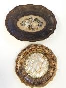 A 19th century papier mache plate painted to simulate tortoiseshell,