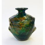 A Mdina glass vase and stopper of swirling designs in brown and yellow, on green ground,