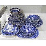 A quantity of blue and white tableware including Burleighware 'Willow' and 'Calico' pattern