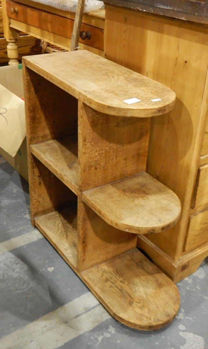 A 20th century pine standing cabinet with three graduating D-ended shelves, side cupboard space,