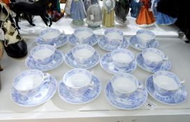 A set of 12 early 19th century Ridgway-style pale blue printed 'Willow' pattern teacups and saucers