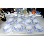 A set of 12 early 19th century Ridgway-style pale blue printed 'Willow' pattern teacups and saucers