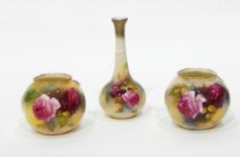 A pair of Royal Worcester vases of globular form, painted with roses on an ivory ground, 7.