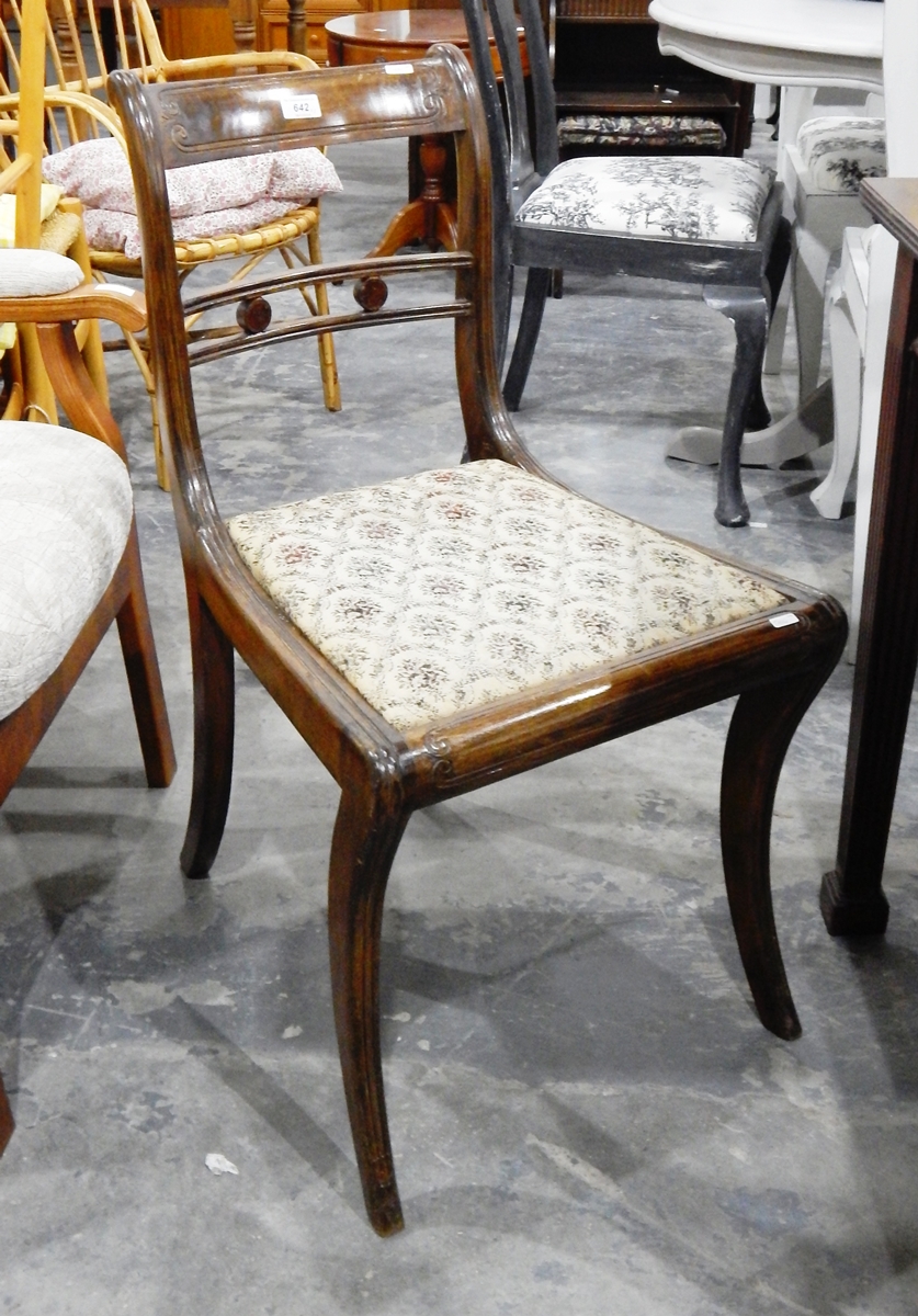 A pair of Regency style dining chairs with carved crest rails (2)