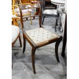 A pair of Regency style dining chairs with carved crest rails (2)