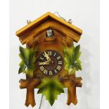 A Garrard mantel clock in oak case, a cuckoo wall clock,