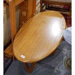 An oval teak-finish coffee table