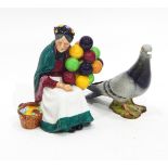 A Royal Doulton figure of 'The Old Balloon Seller' (HN1315), a Beswick model of a pigeon (1383),