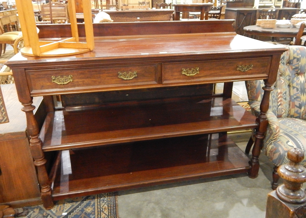 A late 19th century mahogany buffet fitted two drawers to frieze and with two open shelves,