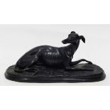 A brass model of a standing greyhound, on rectangular veined green marble base,