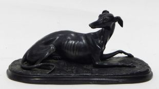 A brass model of a standing greyhound, on rectangular veined green marble base,