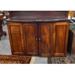 A 19th century mahogany cabinet enclosed by flame mahogany doors, 123cm (af) (door hanging off,