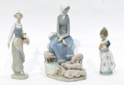 A Lladro figure of a girl carrying a basket of tulips,